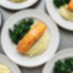 Workplace catering grilled salmon with mashed potatoes and sautéed kale