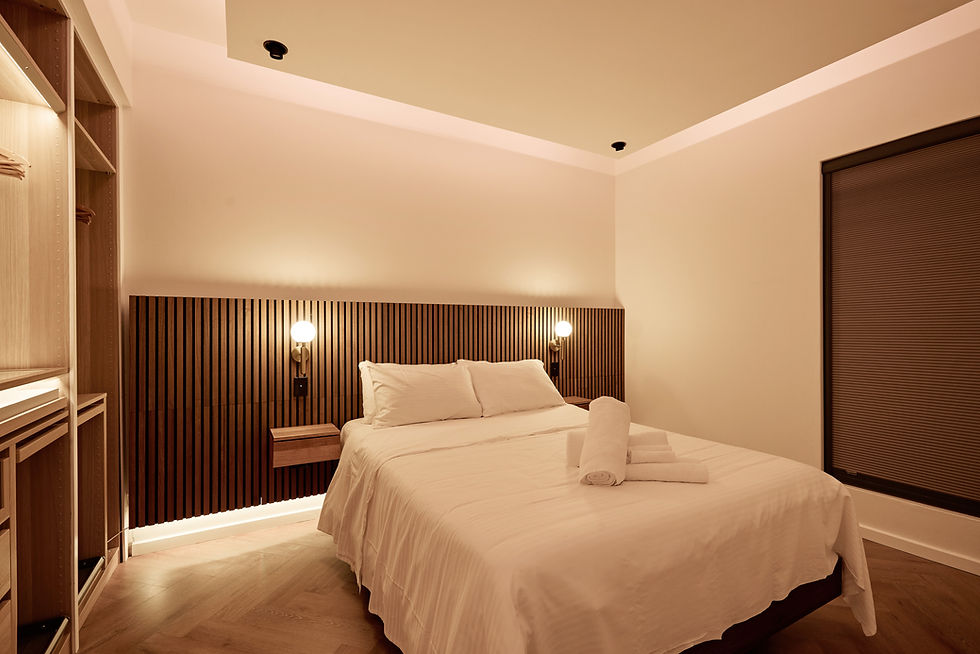 Elegant master bedroom in luxury vacation rentals Sydney with plush bedding