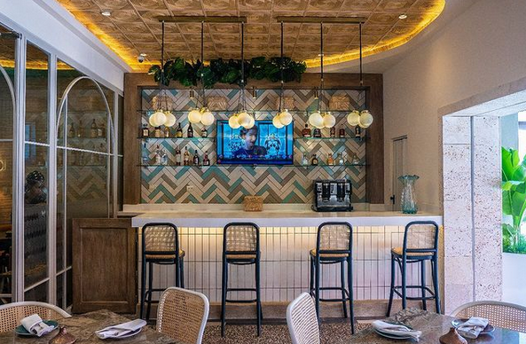 Citrus restaurant's elegant and modern dining atmosphere, offering a range of international dishes, located minutes from Playa Turquesa and Stanza Mare.