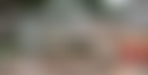 A close-up of the La Cana Golf & Beach Club clubhouse, surrounded by manicured gardens, offering a peaceful retreat after a round of golf