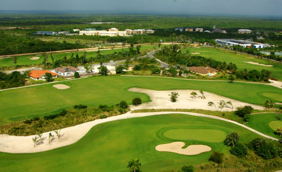 Manicured greens and palm-lined fairways at Punta Blanca Golf Course near popular resorts