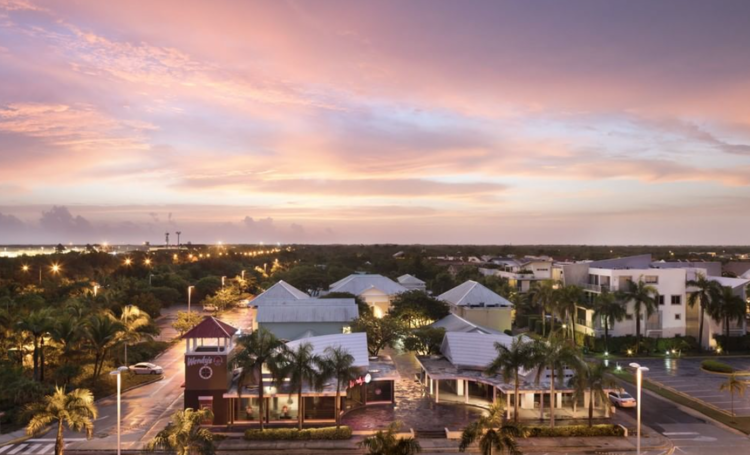 Residential homes in Punta Cana Village, surrounded by tropical greenery and palm trees, providing a peaceful and eco-friendly lifestyle for families and professionals.