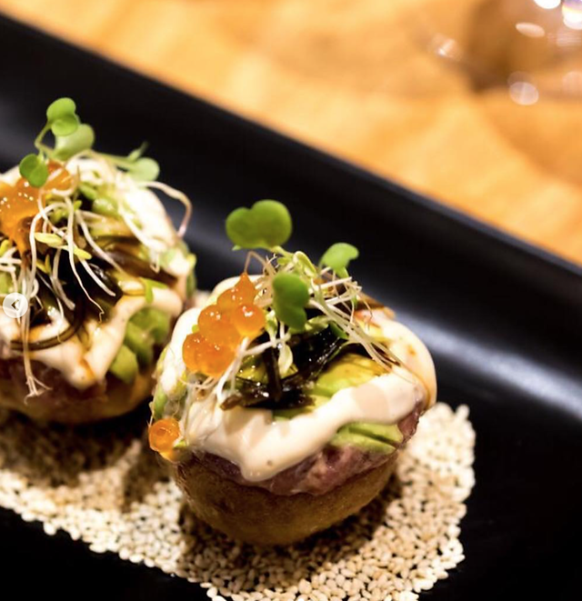 Fresh sushi rolls and tempura dishes artfully presented at Nakamura, one of Cap Cana’s top Japanese restaurants.