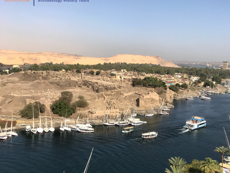 Island of Elephantine with archaeological ruins and boats on the Nile River