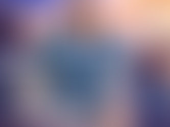 Professional freight dispatch instructor seated with raised hands in front of shipping containers, cargo vessel, and upward-trending price graphs.