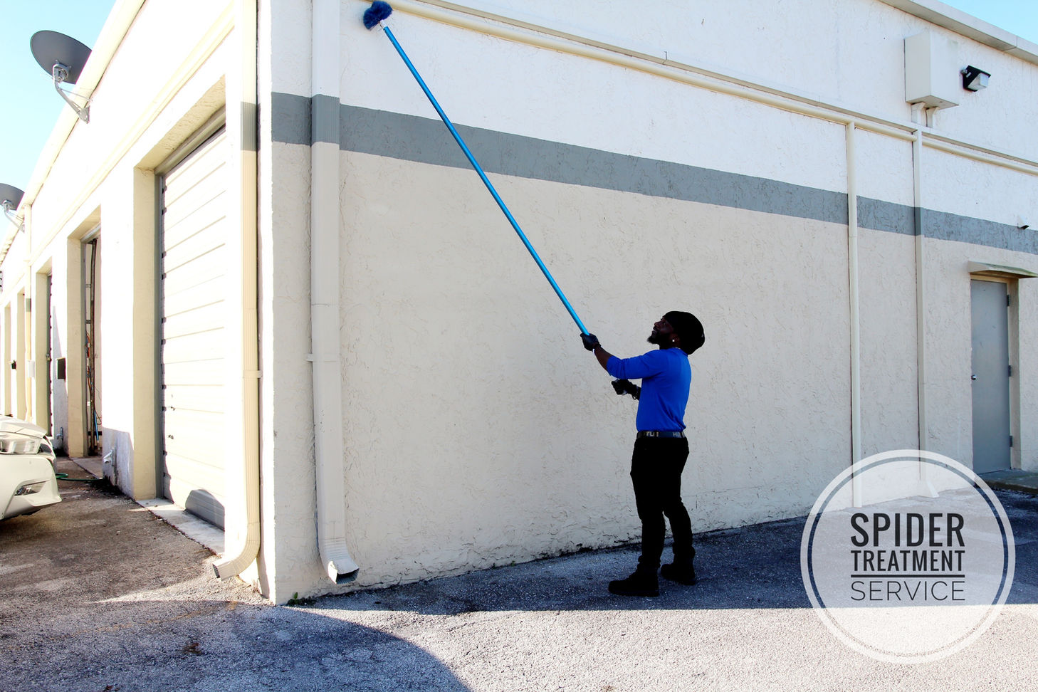 BugLife Pest Control Technician performing spider treatment