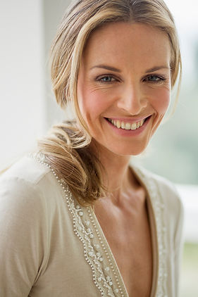 smiling-woman-with-blonde-hair-in-natural-light-2026-03-25-01-19-43-utc.jpg