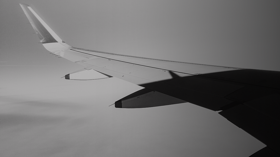Airplane wing in flight symbolizing structure and lift-off through Growth Architecture.