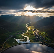 Aerial sunburst through clouds over Eysturoy Island in the Faroe Islands, landscape photography by Andrija Ilic Images, Faroe Islands photo tours