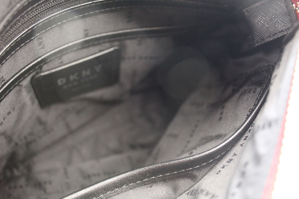 Thumbnail: Interior view of a silver handbag, showing a metallic DKNY label.