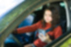 Girl using her phone while driving