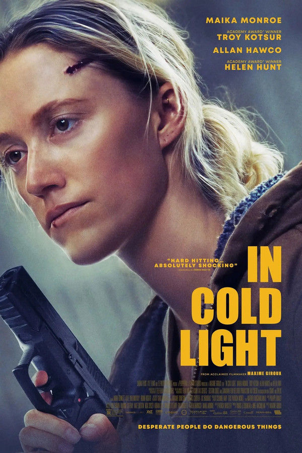 Film poster for In Cold Light showing a tense close-up of a blonde woman holding a handgun, her face bruised and determined, set against a cold, moody background with yellow title text and crime-thriller styling.