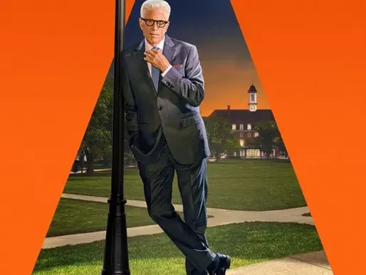 Poster for A Man on the Inside: Ted Danson stands confidently under a streetlamp shining a spotlight on him, dressed in a sharp suit with one hand touching his chin. He leans casually against the lamp post on a neatly kept college campus at sunset. The background is framed by a bright orange triangle of light, with the title “A Man on the Inside” displayed boldly at the bottom.