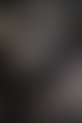 GTA Online Counterfeit Cash Factory interior showing workers operating money printing machines and stacks of counterfeit bills inside an industrial warehouse.