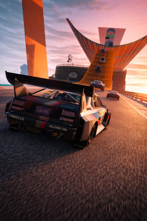 Vertical movie-poster style image of a GTA Online Stunt Race at sunset, featuring a race car with a large rear spoiler accelerating toward a steep orange ramp and massive loop structure, with multiple cars climbing the ramp under a dramatic pink and orange sky.