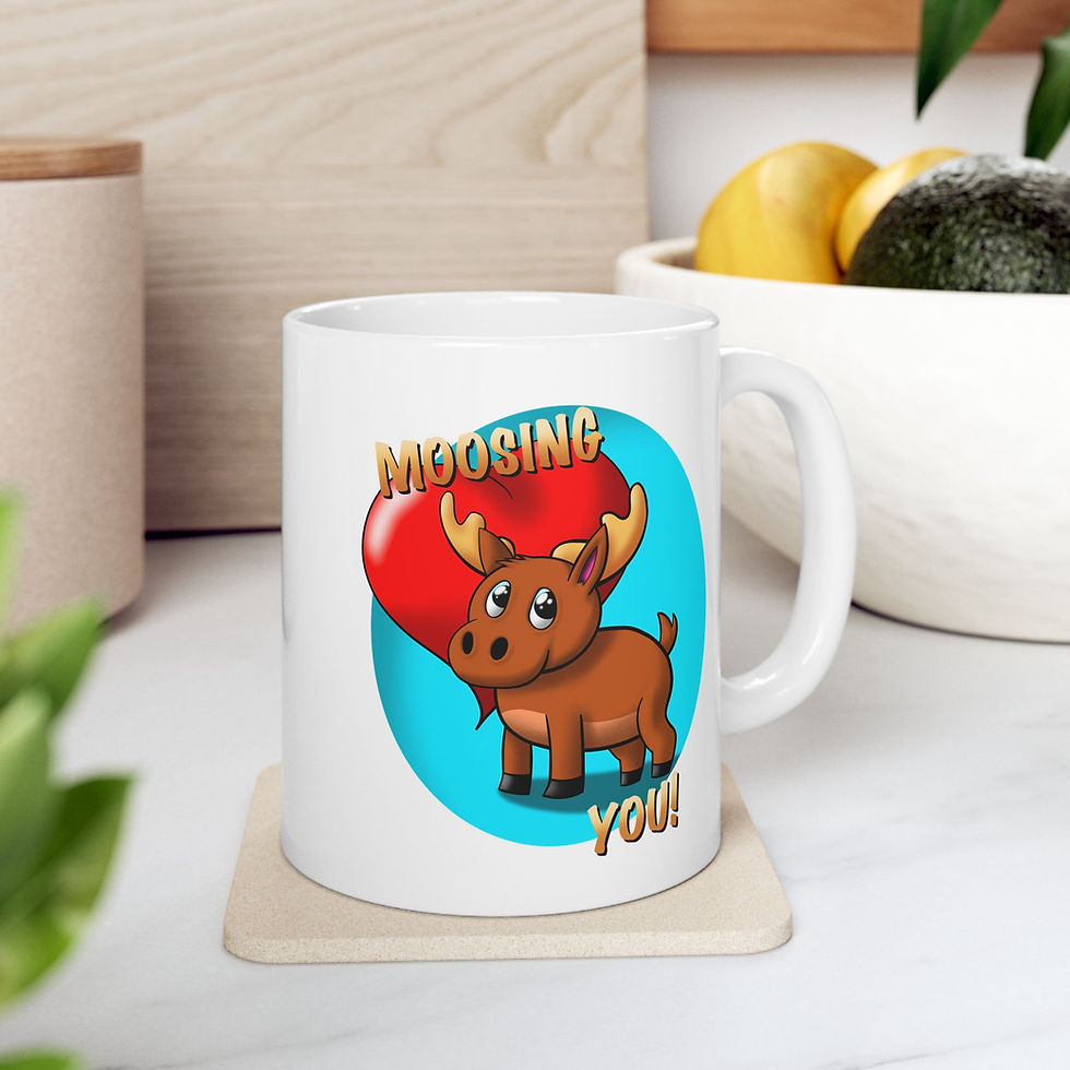 Thumbnail: White ceramic mug featuring a cute cartoon moose holding a big red heart with the text ‘Moosing You!’ kitchen setting