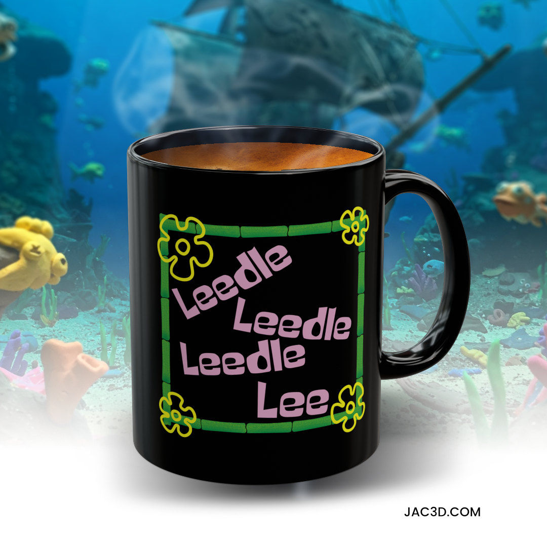 Black ceramic mug with a fun “Leedle Leedle Lee” nautical-nonsense style graphic, using pink text inside a green bamboo frame