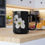 Thumbnail: Dotted Hawthorn Blossom Black Ceramic Mug