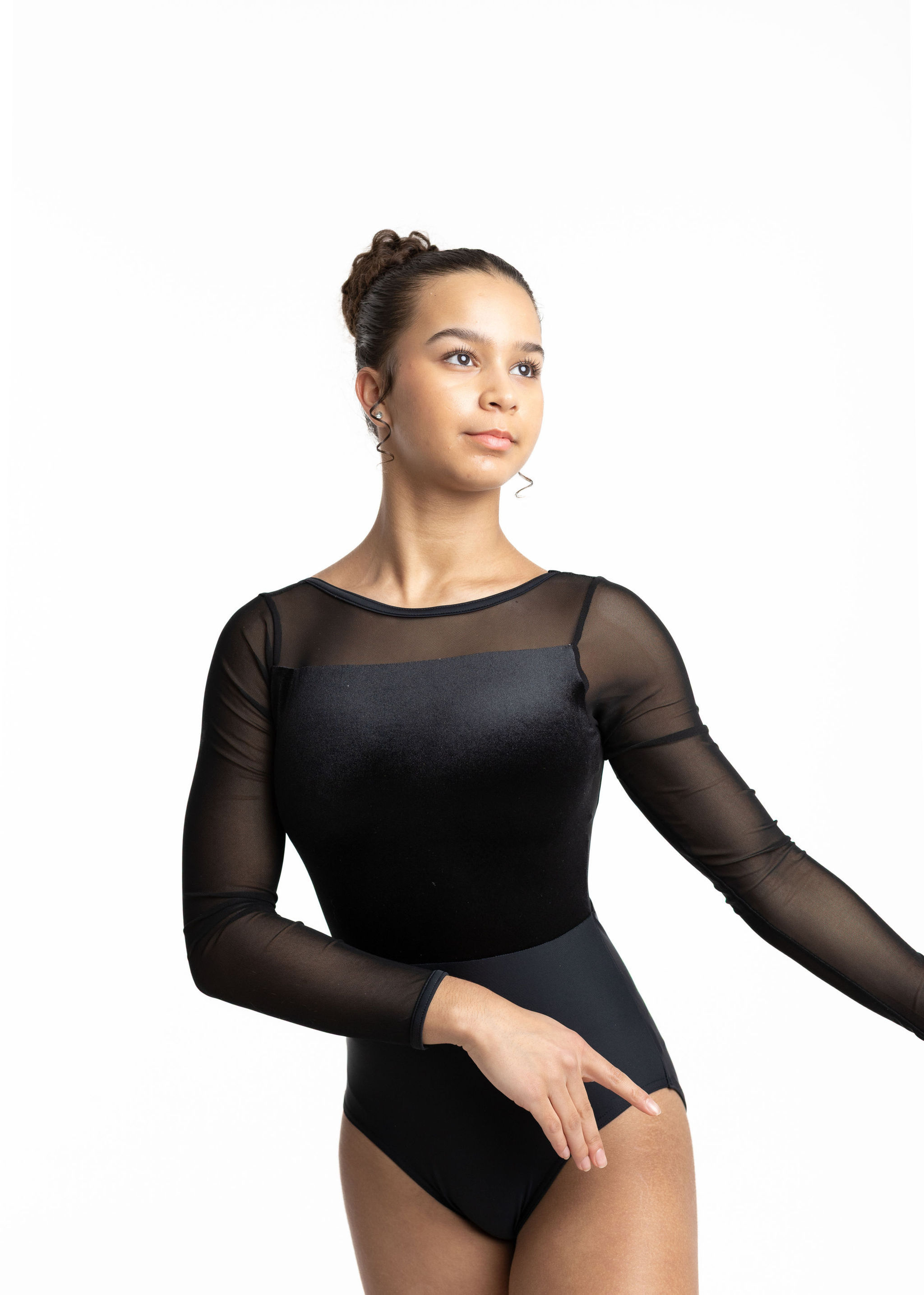 Dancer in black long-sleeve leotard with sheer mesh yoke and velvet bodice.