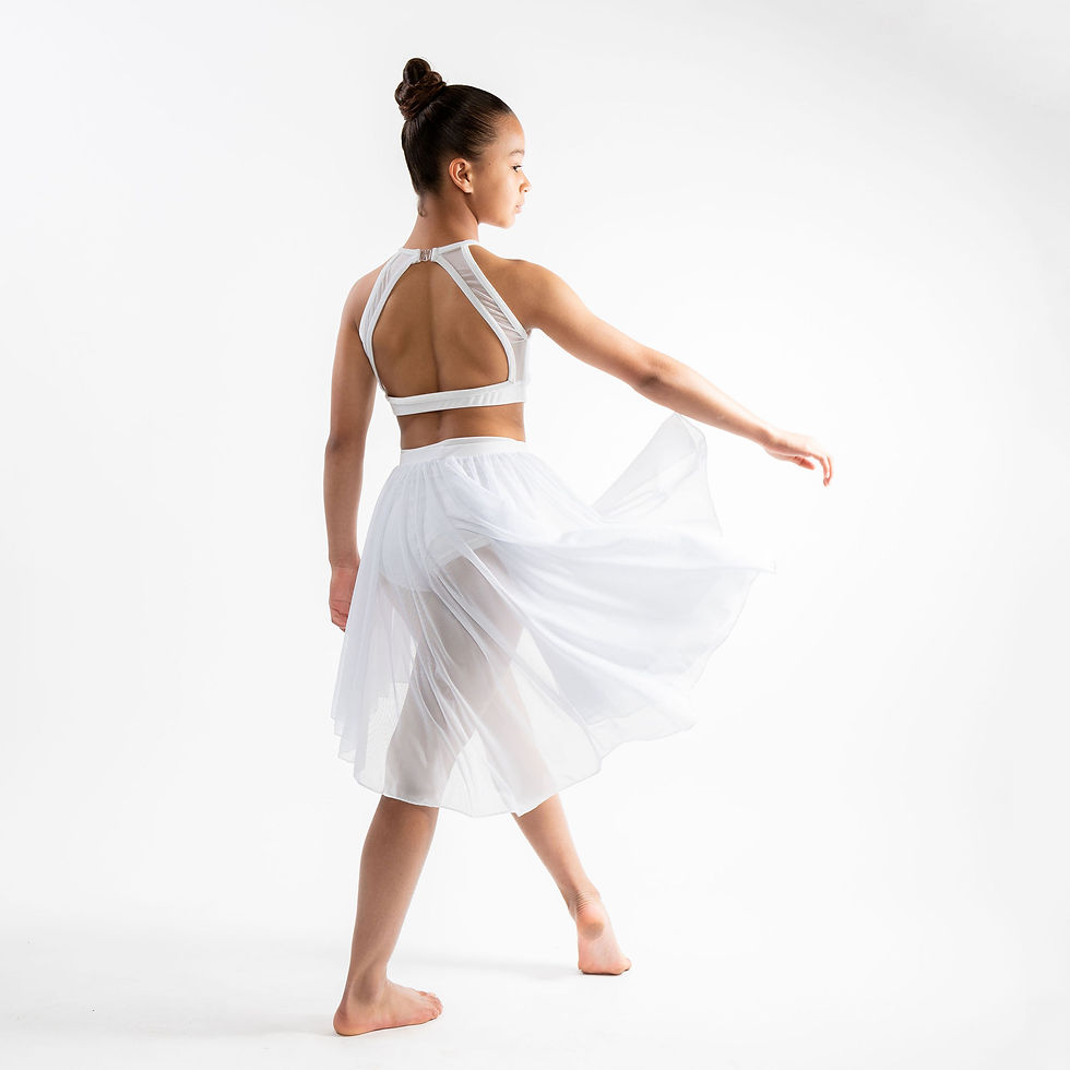 Back view of white halter crop top and sheer midi skirt swirling in motion.