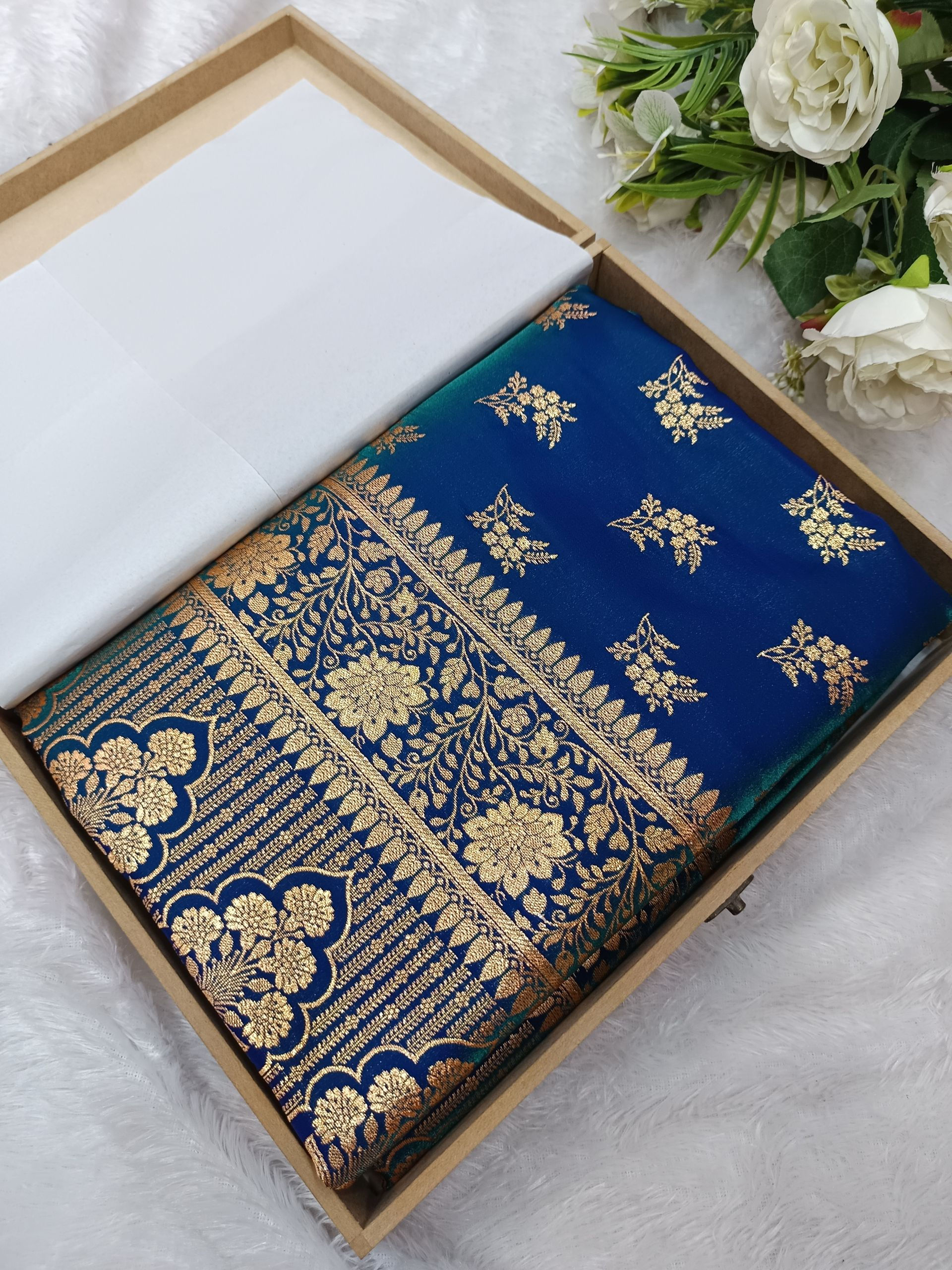 Banarasi silk saree in dhoop chaaon color with floral buti work