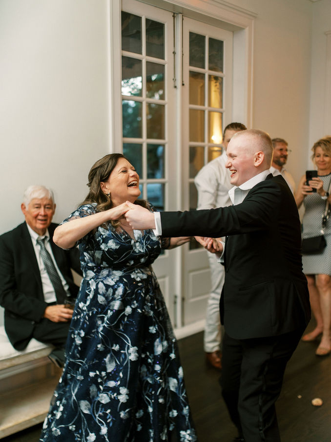 Guests dancing during wedding reception.