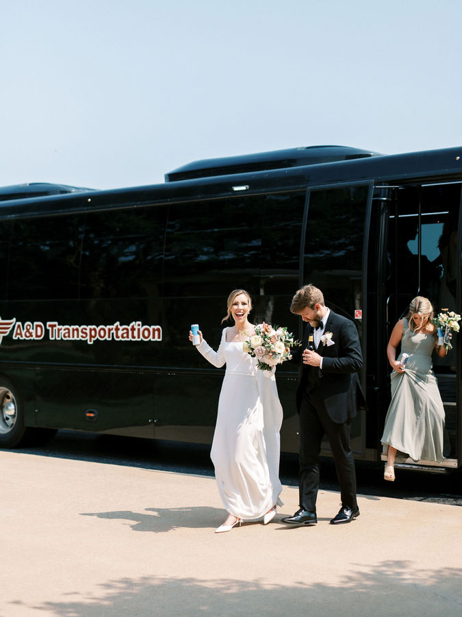 Bride and groom exit in getaway vehicle from Briscoe Manor wedding venue
