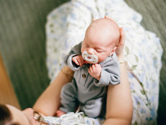 Austin film newborn photographer capturing baby Miles in cozy in-home newborn session