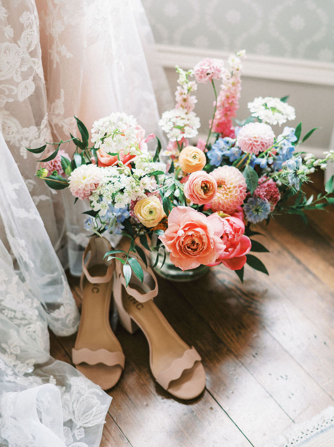 Bridal bouquet and wedding details photographed at Woodbine Mansion.