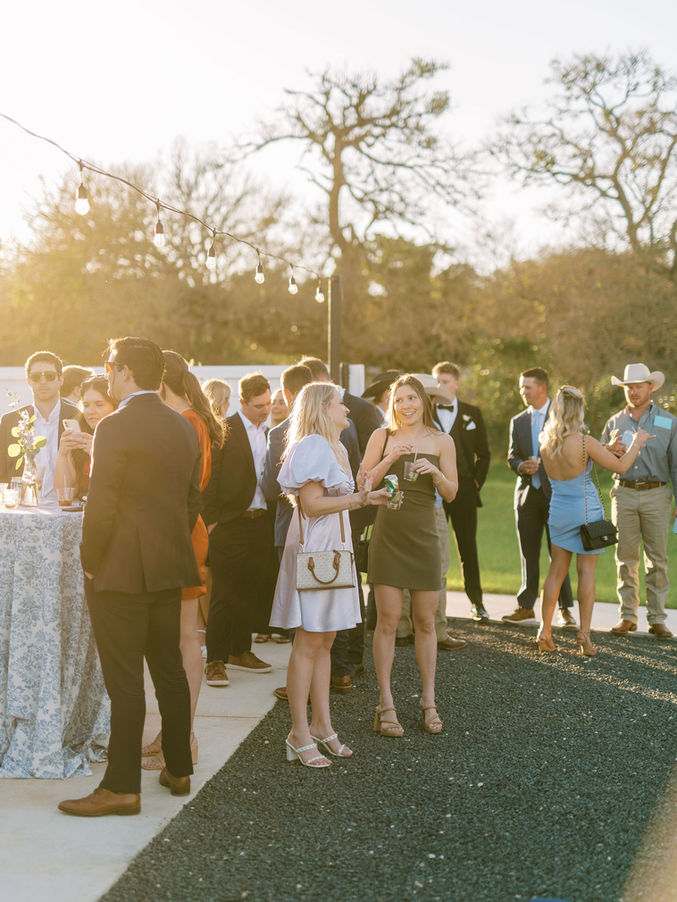 Wedding guests gathered outdoors at Posey Meadows reception