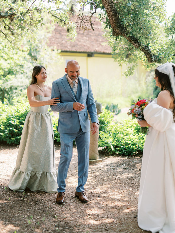 Bride and her dad first look beneath oak trees at Camp Lucy Ian’s Chapel