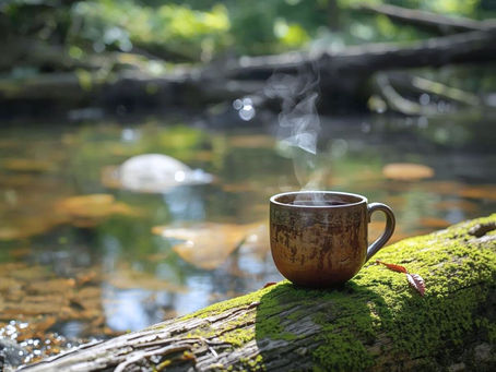 A steaming brown mug on a mossy log by a tranquil forest stream. Sunlight filters through trees, creating a serene, peaceful mood. Symbolizing calm brake.