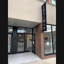 "For more than fifteen years, Keliy Anderson-Staley [b. 1977, Boston, MA] has been working on [Hyphen]-Americans, a photographic tintype portrait series that encapsulates what America looks like today. Using a large-format camera, Anderson-Staley photographs anyone interested in having their portrait taken, regardless of age, sex, or ethnicity, as she continually adds to her collection of more than 4000 portraits. In 2017, after her Houston home and studio were flooded by Hurricane Harvey, she created Shelter in Place, a wooden house constructed of 560 portraits of local residents, as a testament to the strength and resilience of Houstonians. The idea of building a house of strangers redefines the concept of home. 

In 2012, Syrian activist turned photographer Omar Imam [b. 1979 Damascus, Syria] was kidnapped and tortured by a militia and only let go when a friend intervened. Soon after, Imam left Damascus, first settling in Beirut, and now residing in Amsterdam with his wife and children. Syrialism is Imam’s response to the reality of torture experienced by himself and other refugees who settled in Lebanon and other European countries. Like his earlier work, Imam met and talked with numerous refugees who had been abducted, recreating painful memories to bring awareness about the psychological and physical torment that continues today. No longer able to live in their native homelands, each person pictured has had to adopt a new place to call home.

Rubén Martín de Lucas’ [b. 1977, Madrid, Spain] work challenges the concept of home by constructing arbitrary boundaries in unexpected places. In Minimal Republics, he creates photographs about the concept of borders and our need for the structure they provide. Martín de Lucas creates each image the same: define and allocate 100㎡ of space and inhabit it for 24 hours. From wheat fields to soccer fields to expanses of dried earth, unidentified pieces of land are transformed into a temporary residence for one."