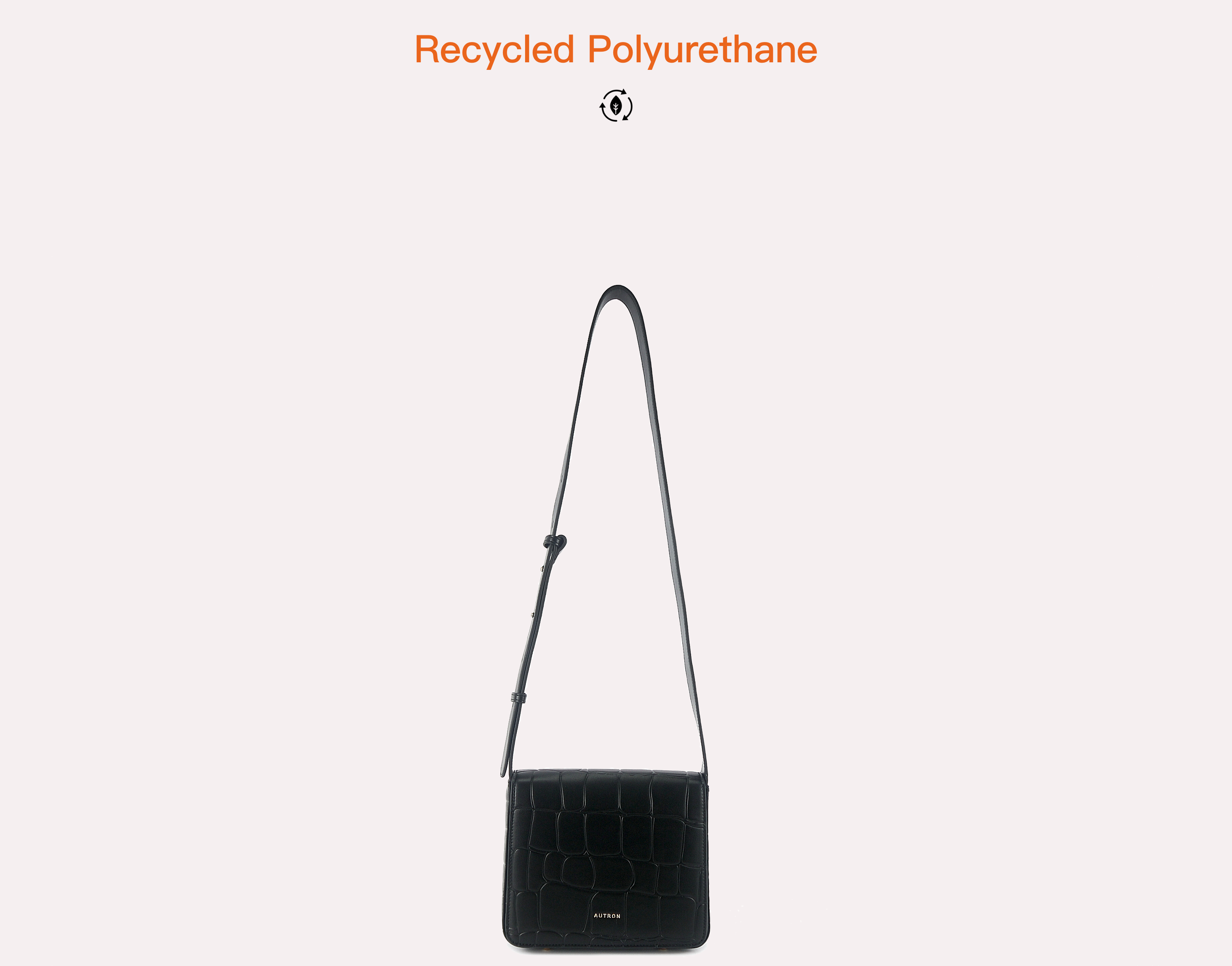 Small black croc-embossed crossbody bag with an adjustable strap and subtle AUTRON logo on the front.