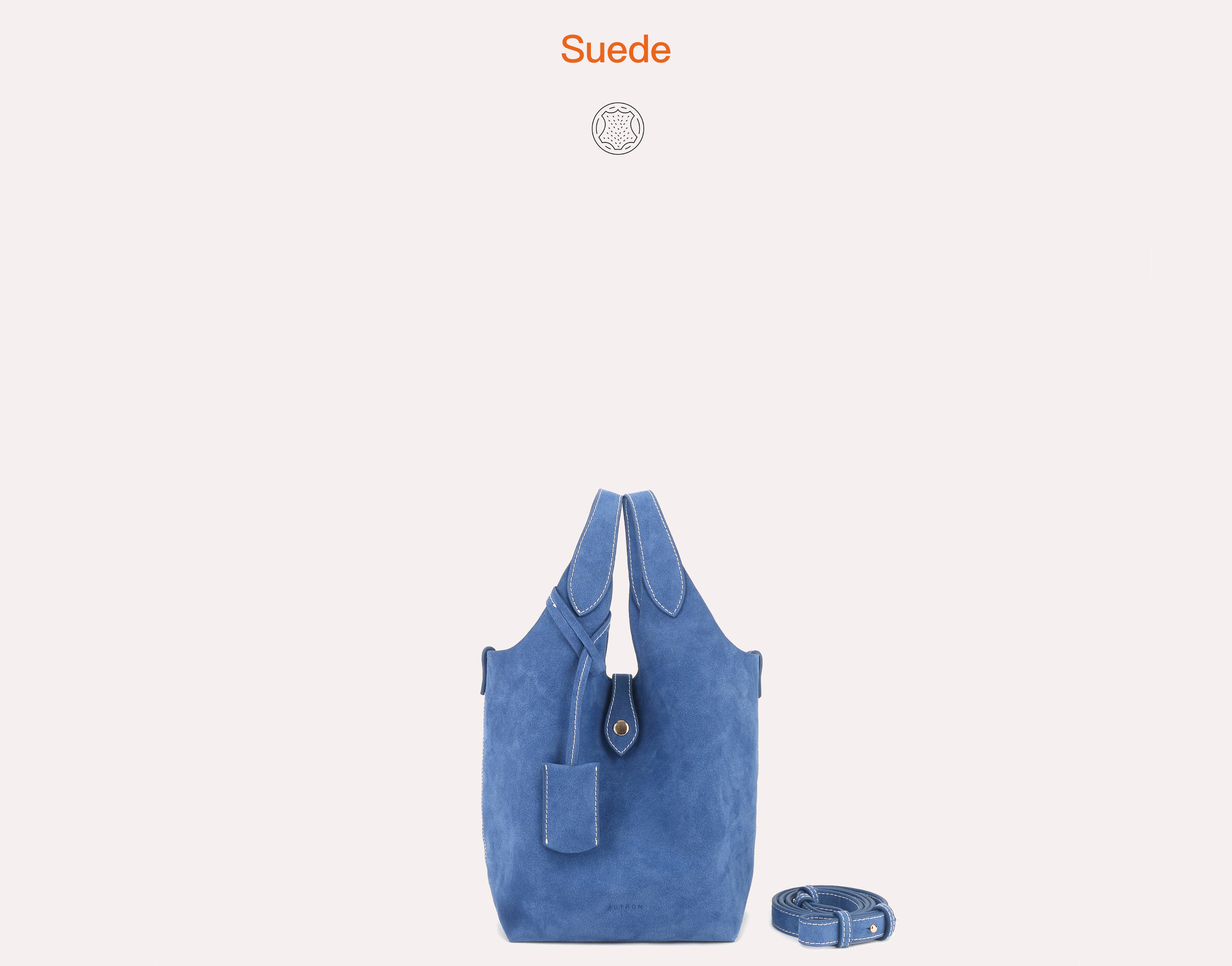 Blue suede bucket tote bag with double top handles and detachable shoulder strap