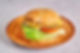 Hamburger on a wooden plate.