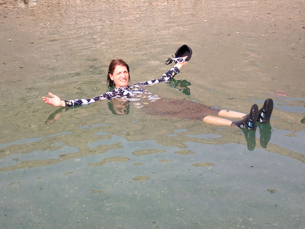 Kayak the Dead Sea: Ruth floating in the saline water of the dead sea