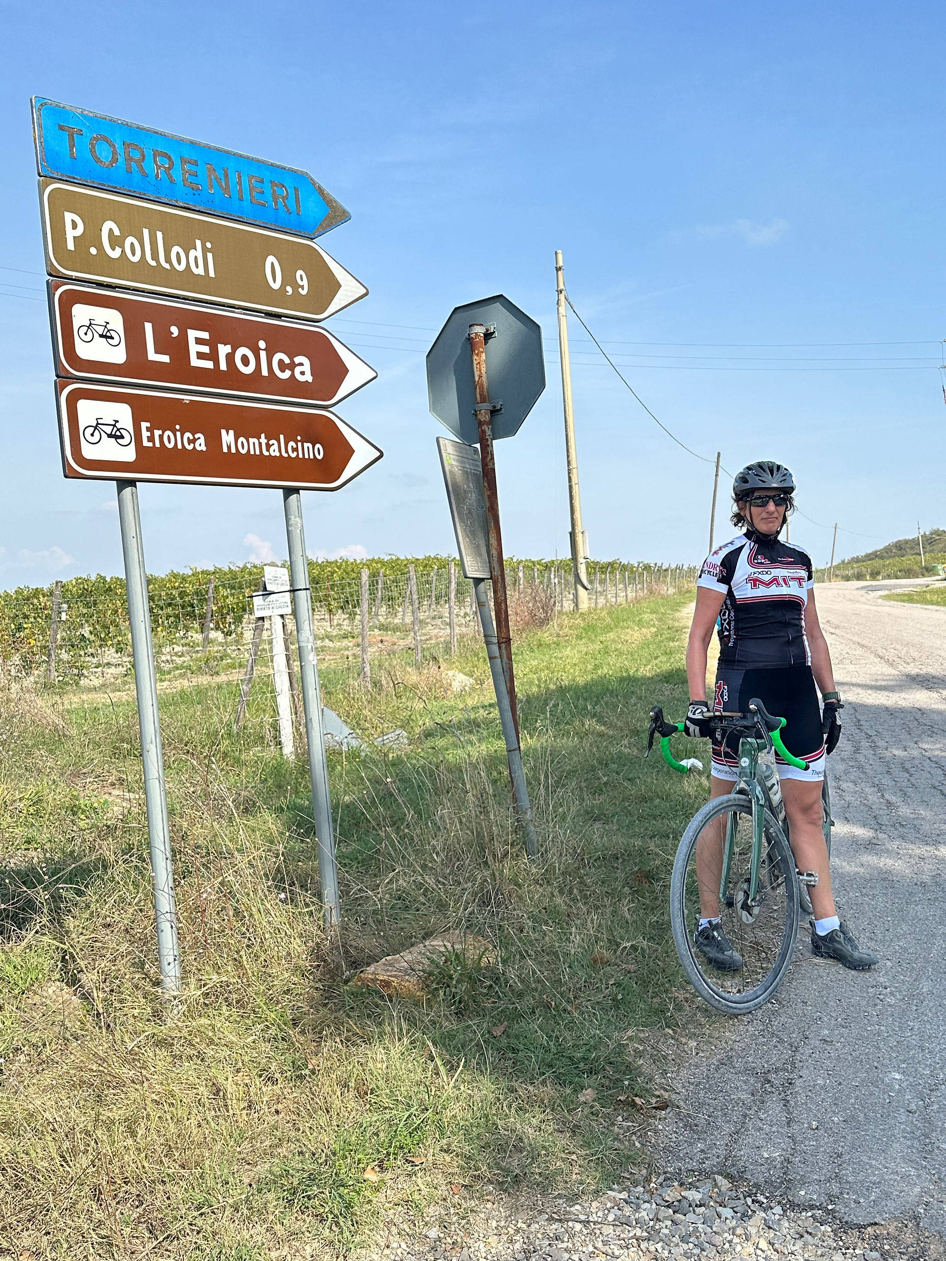Gravel Biking Tuscany: Ruth at a road sign for L'Eroica