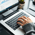 hands typing on a laptop keyboard.jpg