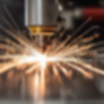 Close-up of fibre laser cutting through steel, detailing the precision and technology behind our manufacturing process