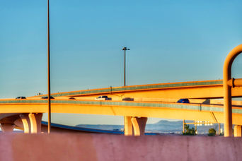 Mountains contrasting with the golden highway decorated by cars caught my eye on this fall afternoon.