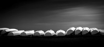A line of lifeboats on Lake Ontario, in the Beaches neighborhood of Toronto, Ontario.