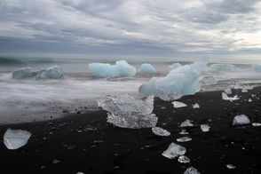 Taken on the Southern Coast of Iceland of icebergs that brake off of the nearby glacier and float out to see. They rest on the black sand beach created from the years of volcanic eruptions, capturing the reason the country is called the land of fire and ice.