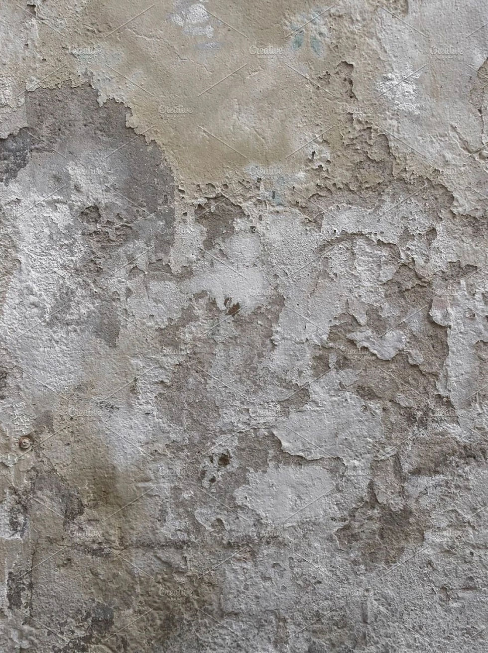 Decorative plaster texture with natural stone-like patterns in soft tones
