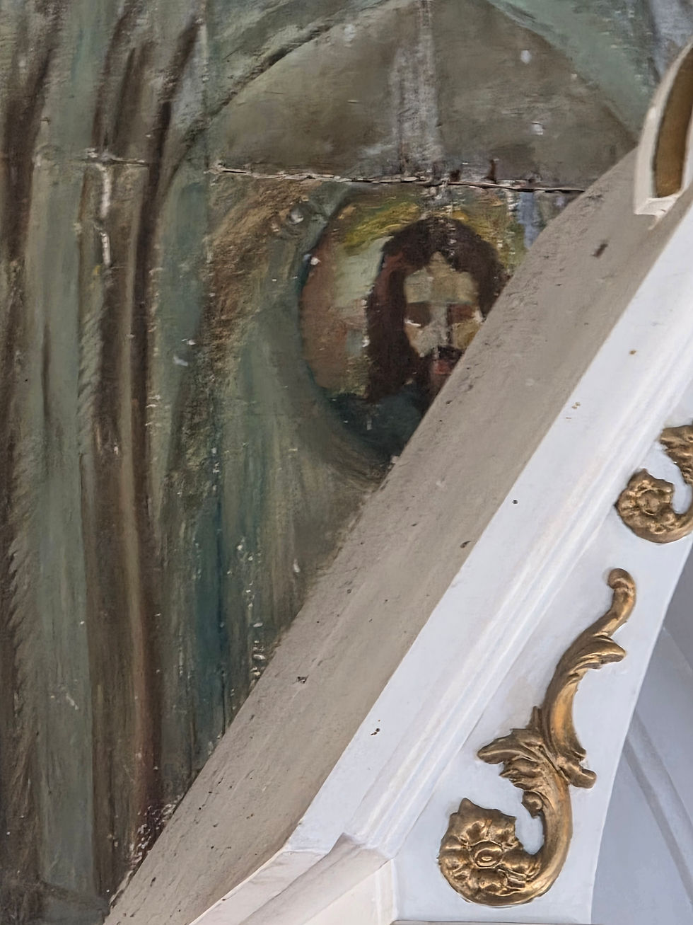 Photograph from inside a painted church in Hawaii. Christ watching from behind the alter.