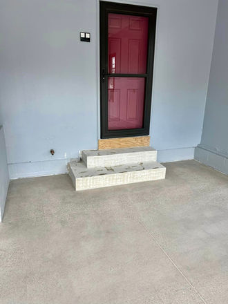 Polished concrete floor, steps, and door