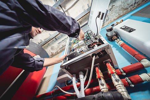 air-conditioning-technician-is-checking-air-conditioner.jpg