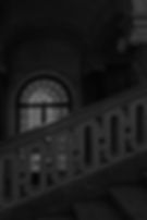 vertical-grayscale-shot-beautiful-stone-railing-historical-building-night.jpg