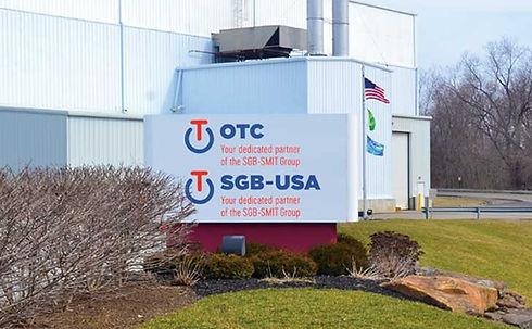 Exterior view of OTC Services' 100,000 square foot facility with direct rail access