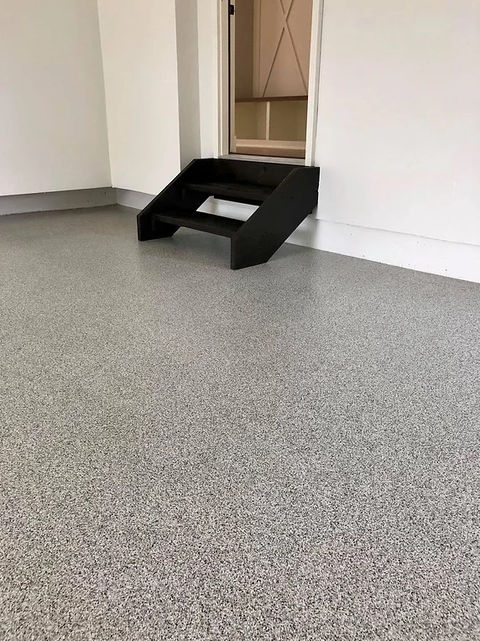 Epoxy garage flooring, showcasing a sleek, gray finish.